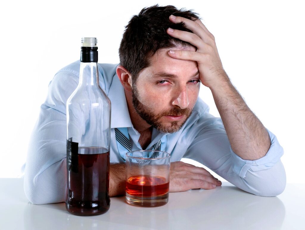 drunk business man wasted drinking whiskey in alcoholism